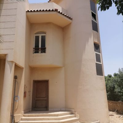 Separate villa, 670 square meters, building land, 350 square meters, ground, first, and roof, semi-finished, for sale inside Zizinia Compound, Fifth Settlement.